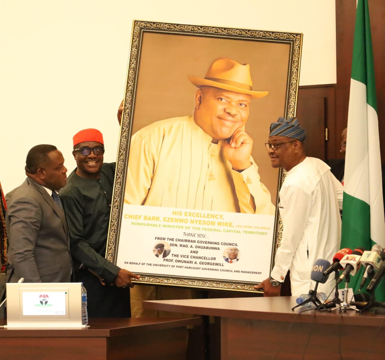 FCT Minister Barrister Nyesom Wike (right) receiving a portrait of himself from Pro Chancellor University of Port Harcourt, Sen. Mao Ohumbunwa (2nd left) and Vice Chancellor Prof. Onwunari Abraham Georgewill during a courtesy visit by the Uniport Governing Council to the Minister on Monday.